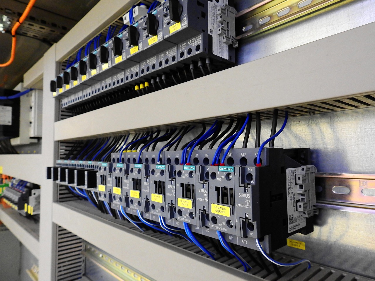 Industrial circuit breakers and contactors in a distribution panel