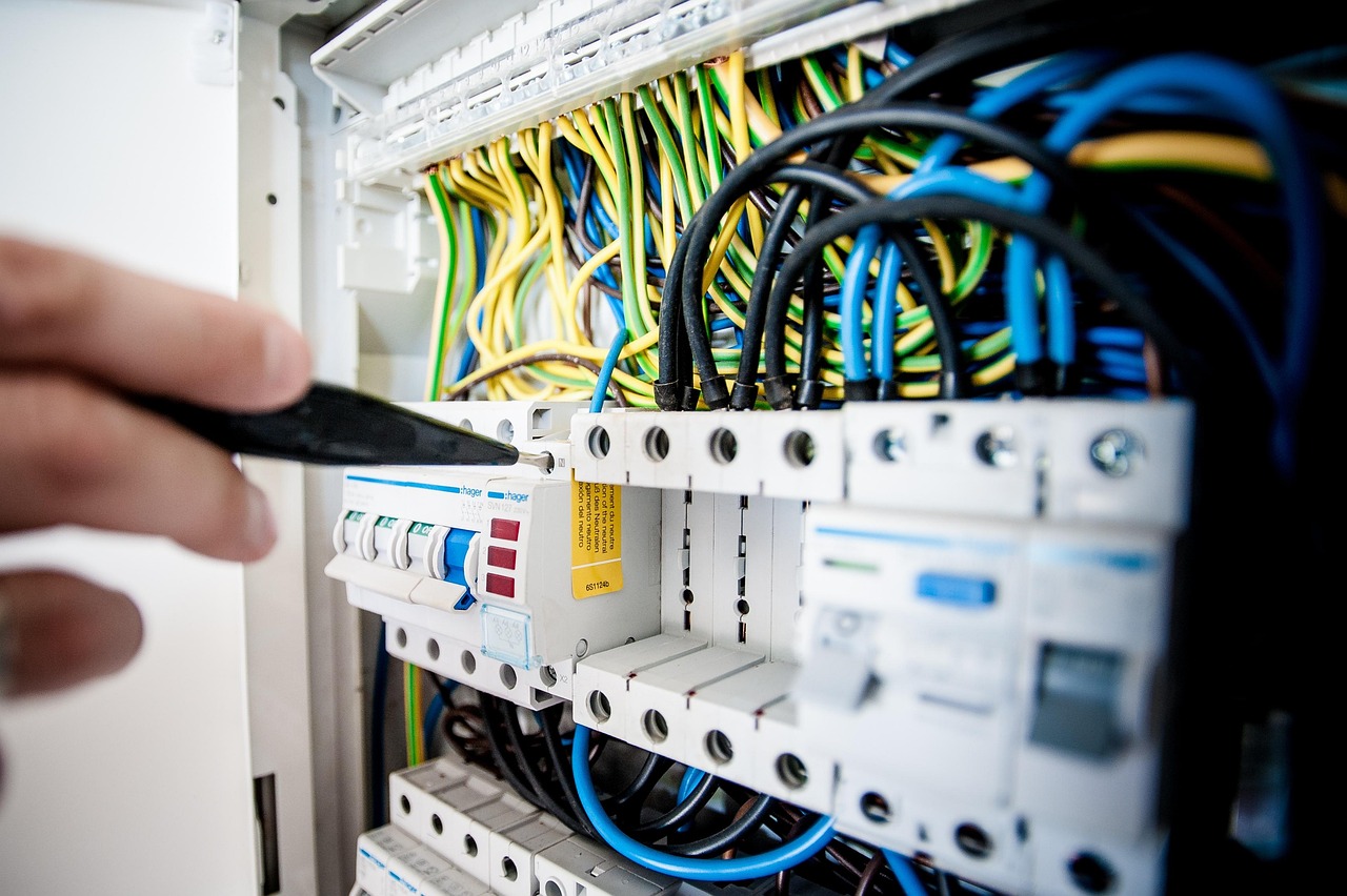 Electrician checking a circuit breaker panel